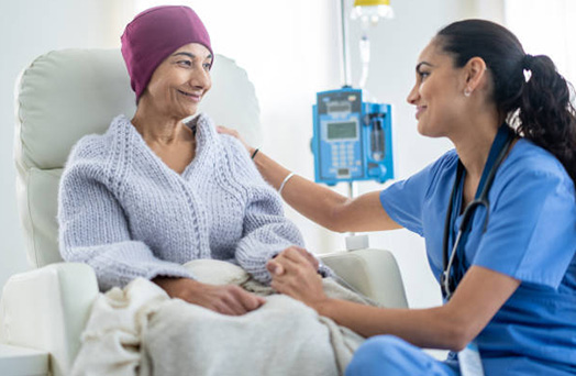 An image depicting a compassionate doctor interacting with a cancer patient